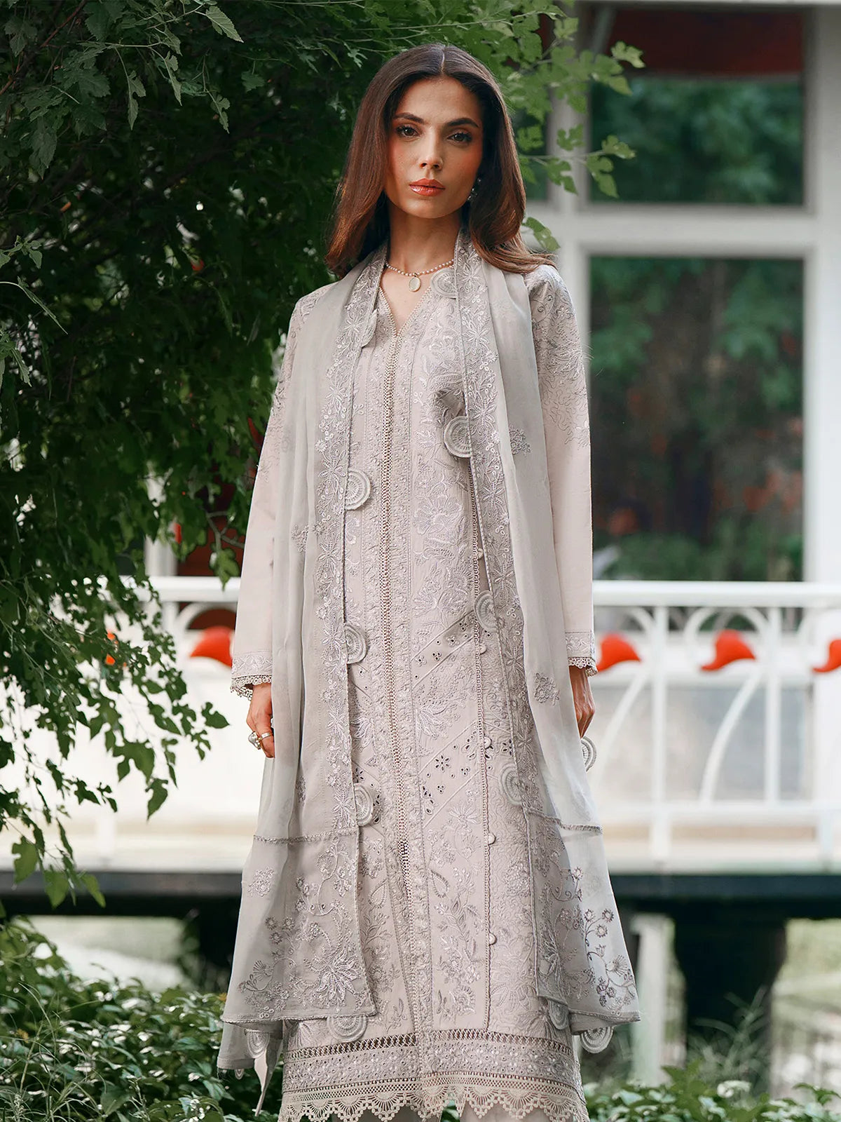 Front full-length view of light grey lawn stitched 3-piece suit featuring scalloped cutwork dupatta borders and detailed embroidery from Baad-e-Saba by INEJ.