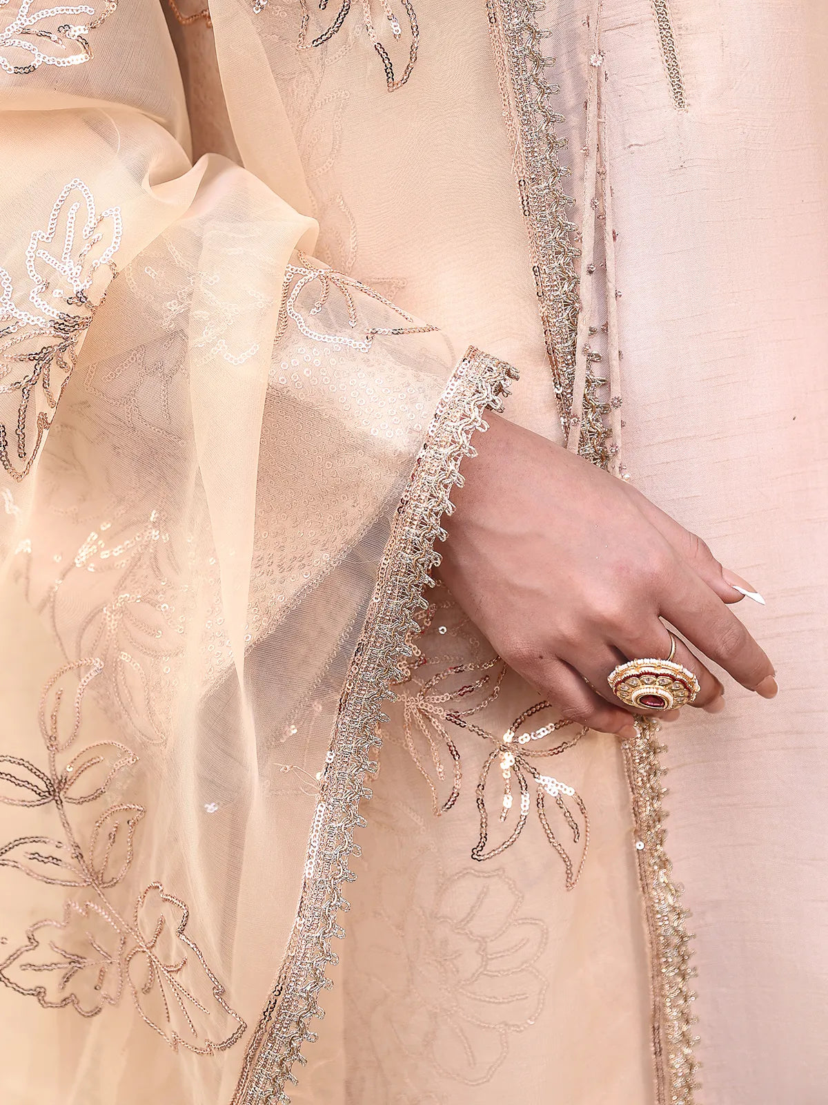 Detailed close-up of sequin leaf embroidery motifs on peach organza dupatta from Khat by INEJ.