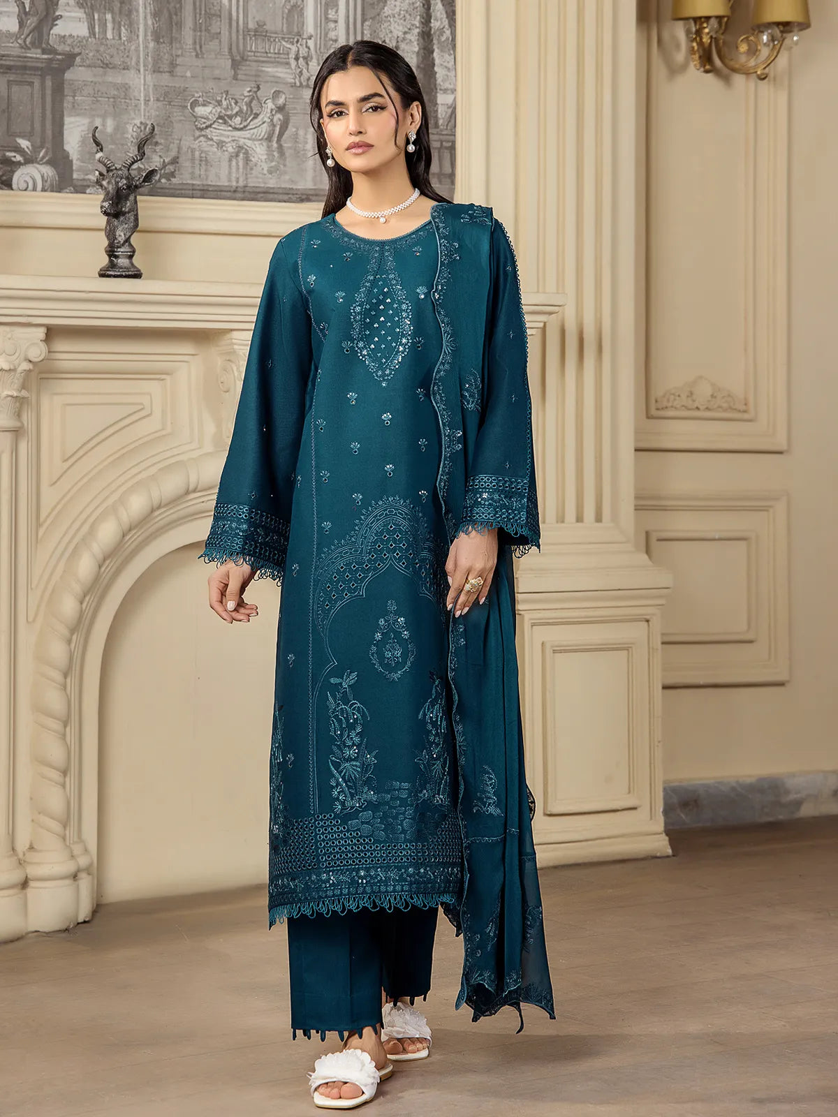 Full front view of a model wearing a teal blue 3-piece embroidered lawn suit with matching dupatta and straight trousers by INEJ.
