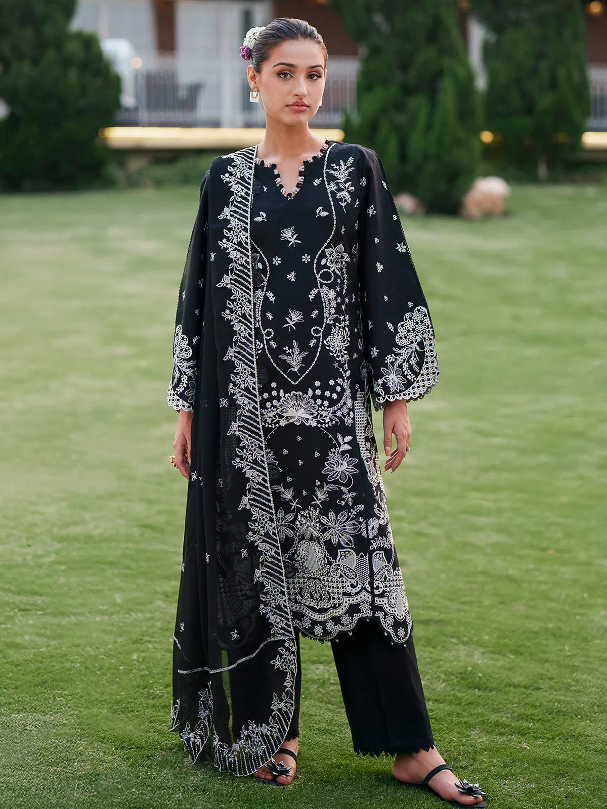 Front full-length view of black lawn stitched 3-piece suit featuring detailed white floral embroidery from Baad-e-Saba by INEJ.