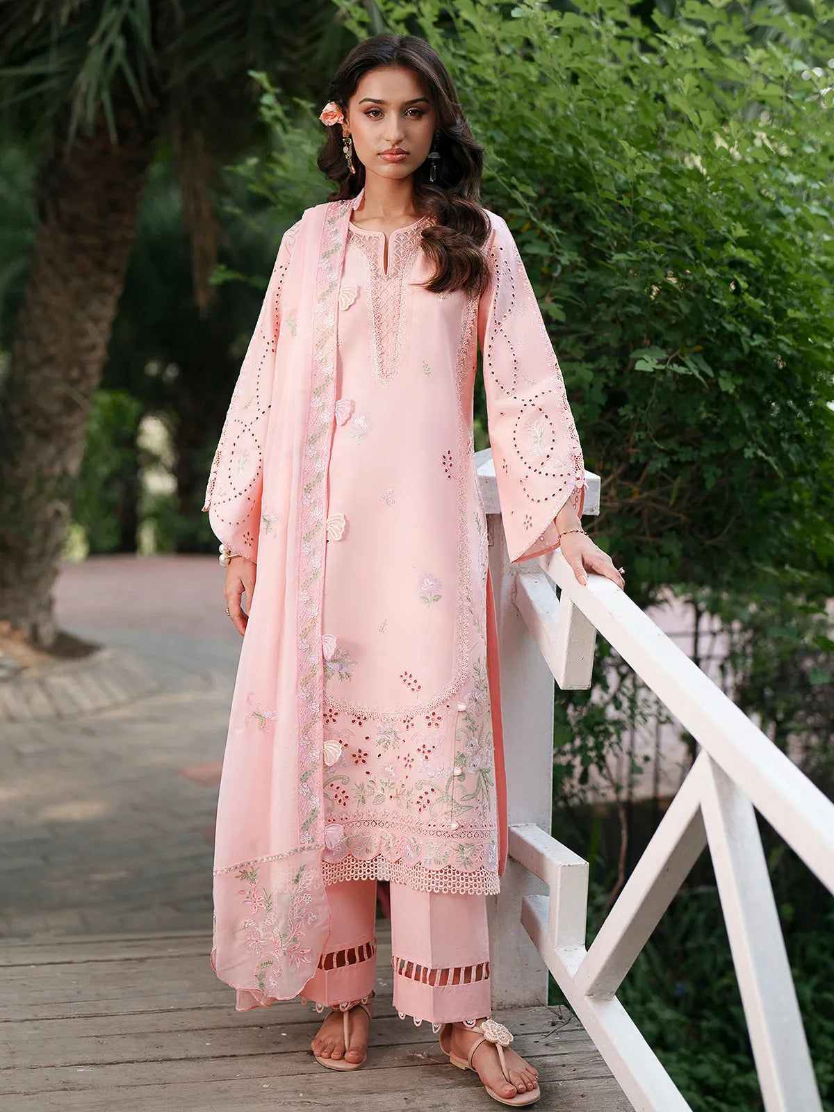 Front full-length view of pink lawn stitched 3-piece suit featuring eyelet sleeve details, embroidered daman, and cutwork trouser cuffs from Baad-e-Saba by INEJ.
