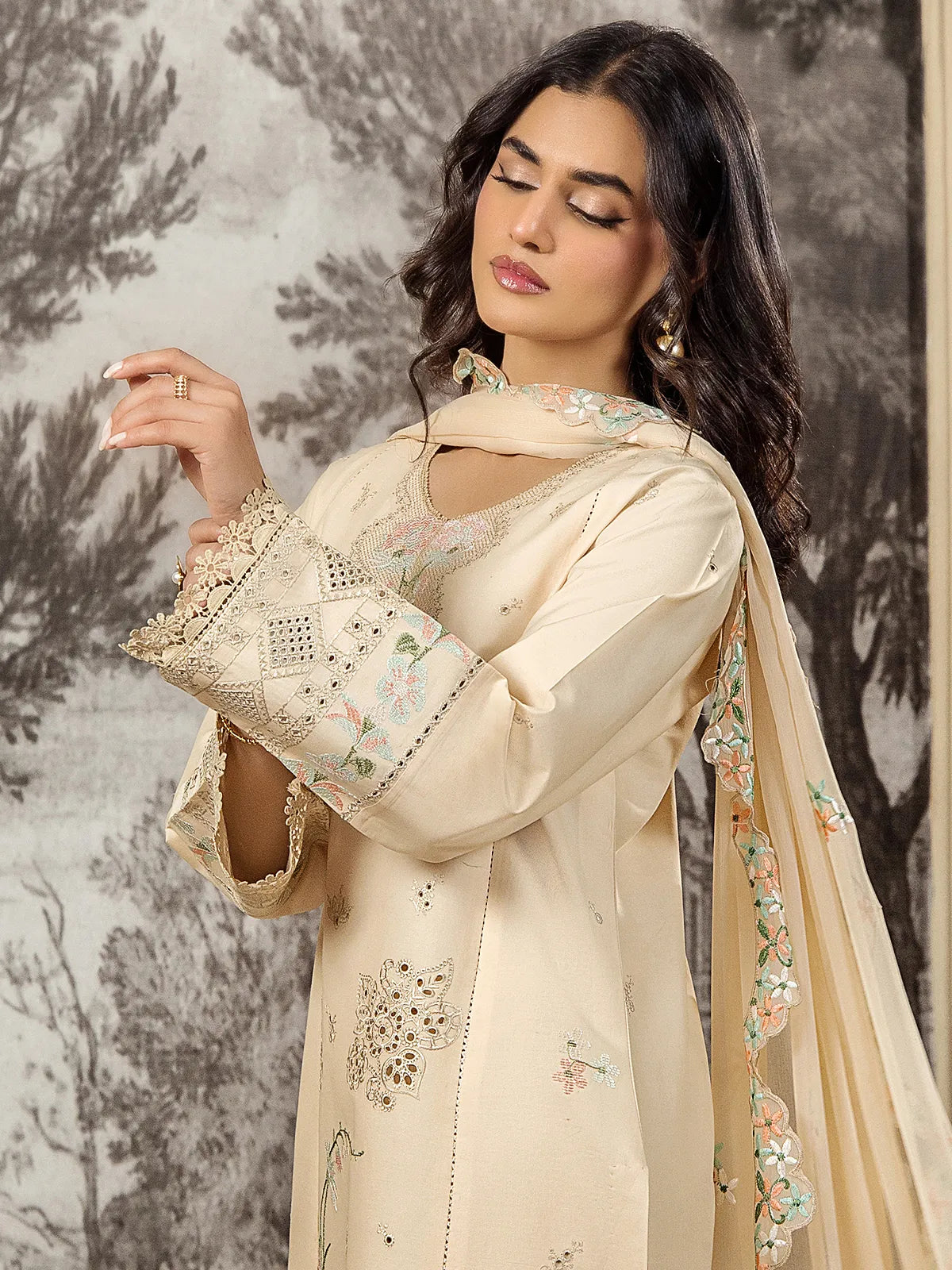 Medium shot showing geometric lace sleeve borders, embroidered neckline, and scalloped floral dupatta drape on beige lawn suit by INEJ.