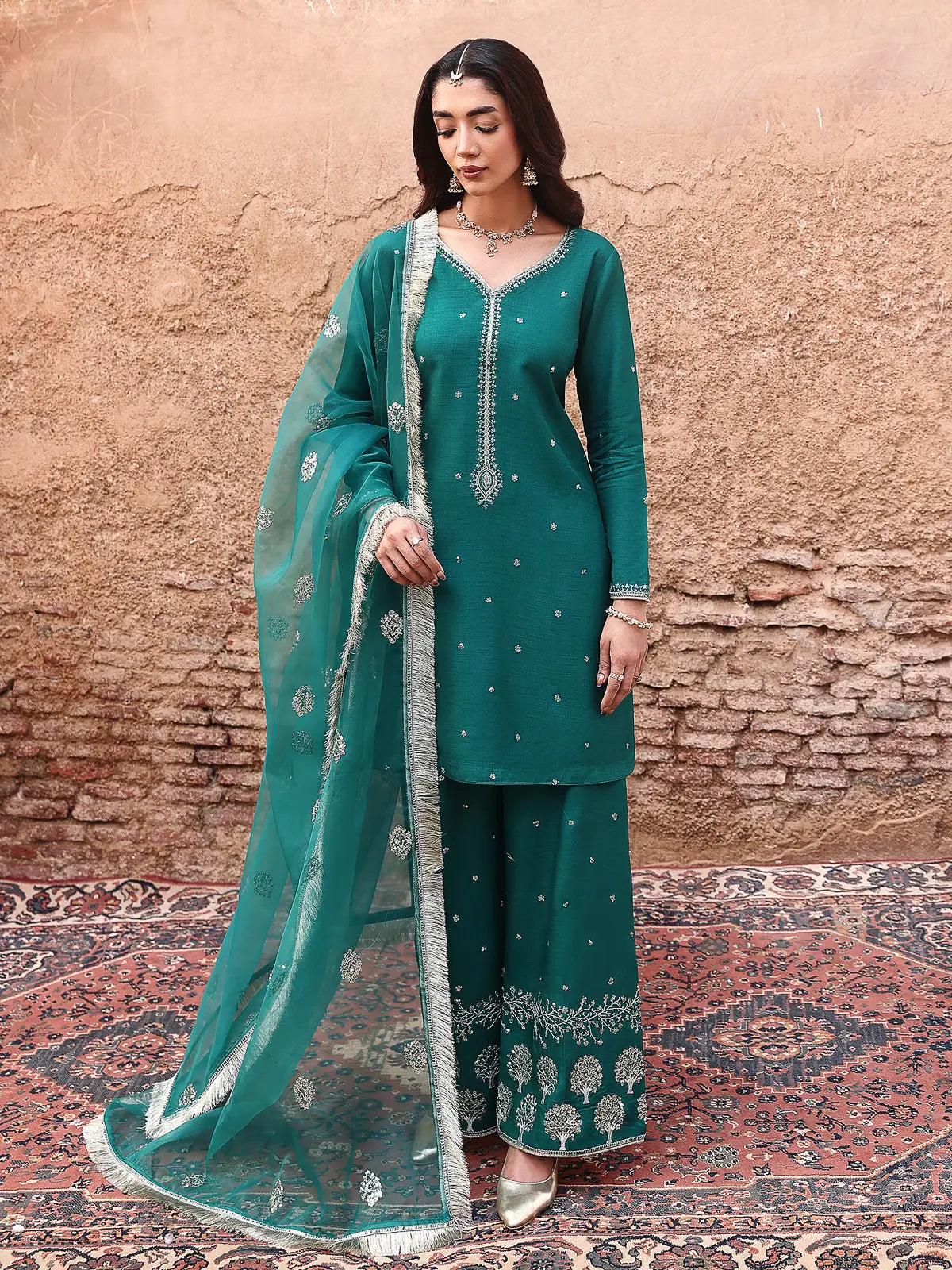 Front full-length view of teal embroidered stitched 3-piece luxury silk suit from Khat by INEJ.
