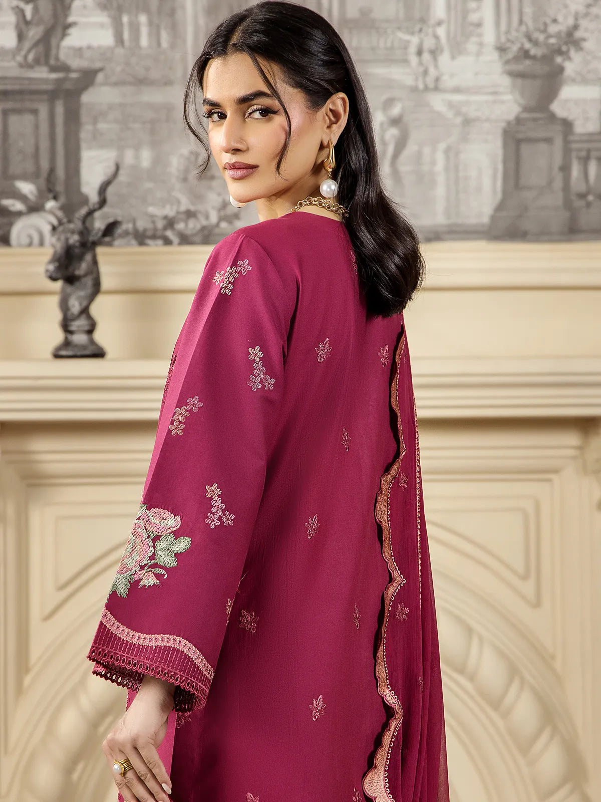 Side view showing floral embroidered sleeves and subtle back motif sprigs on deep maroon luxury lawn shirt by INEJ.