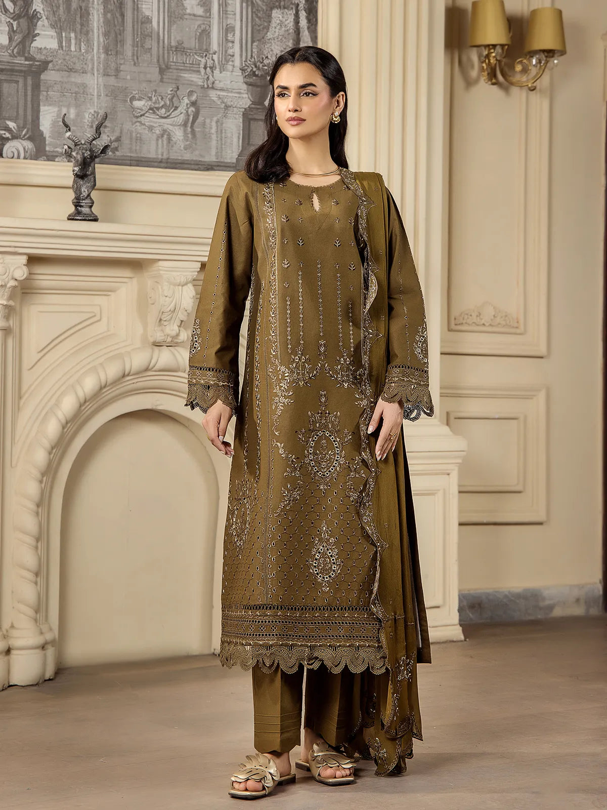 Full front view of a model wearing an olive green 3-piece embroidered lawn suit with matching scalloped dupatta and tailored trousers by INEJ