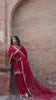 Video reel close-up showing a model in the Surkhab crimson red silk suit featuring detailed neckline handwork from the Khat collection by INEJ.